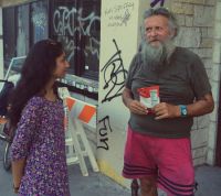 VideoMed cofounder Kavina Patel speaks to David, a homeless man in Austin.