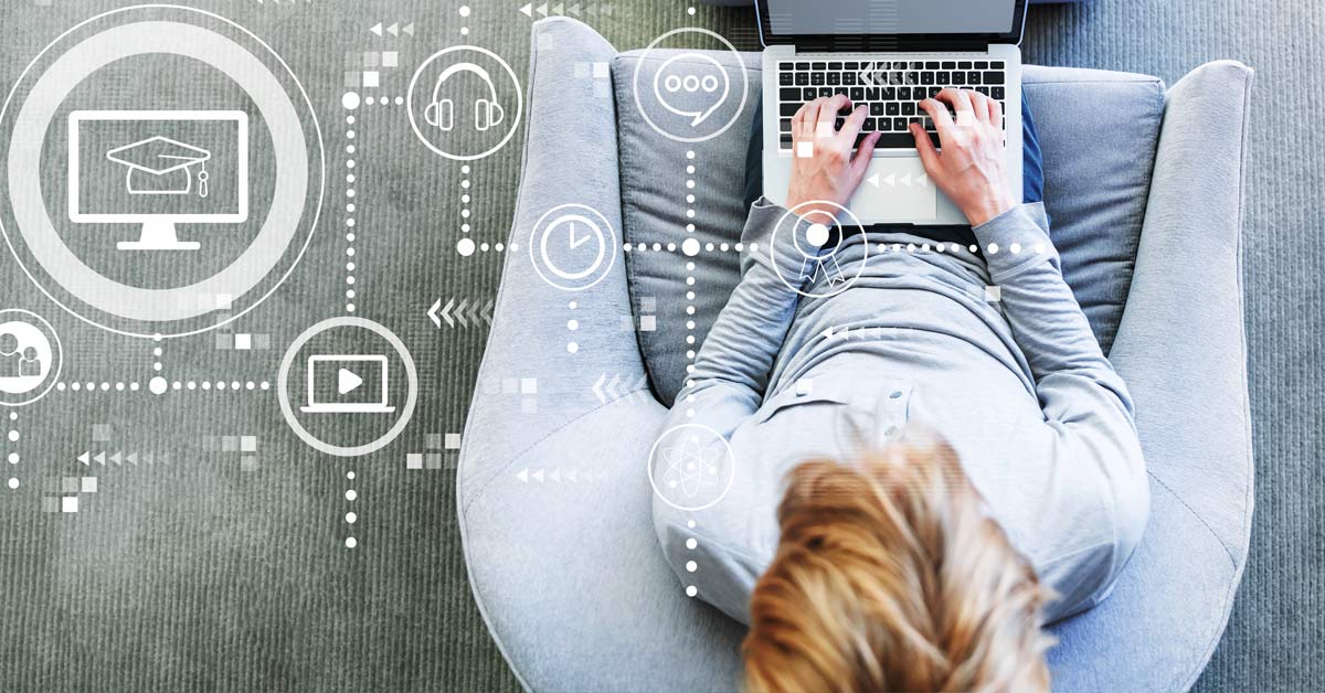 Overhead photo of a woman sitting in a chair on a laptop with super-imposed computer icons to the left of her.