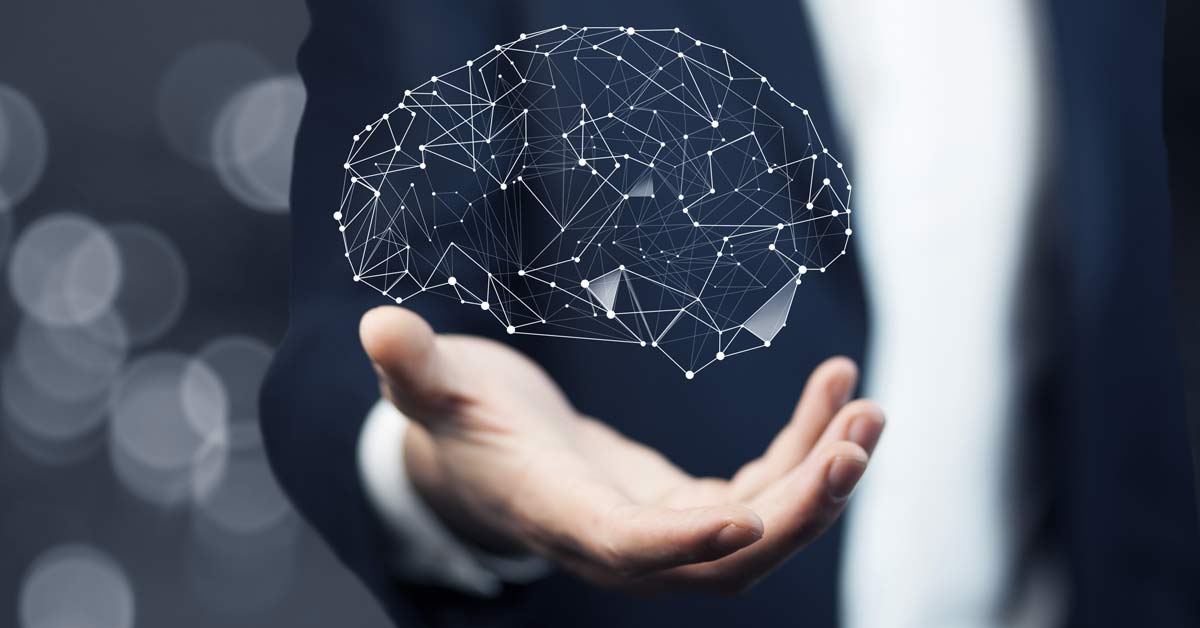 A close up photo of a hand with a super-imposed illustration of a brain hovering over it.