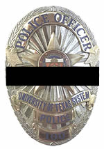 badge with a black bar over it