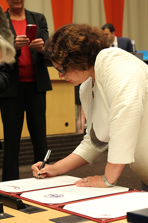 Julie Goonewardene signs charter documents at the UN’s Small Business Knowledge Summit focusing on micro, small and medium-sized enterprises.