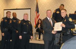 UT System Director of Police Michael Heidingsfield with Chancellor McRaven delivering diplomas.