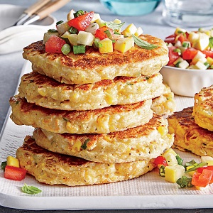 Stack of corn cakes with salsa.