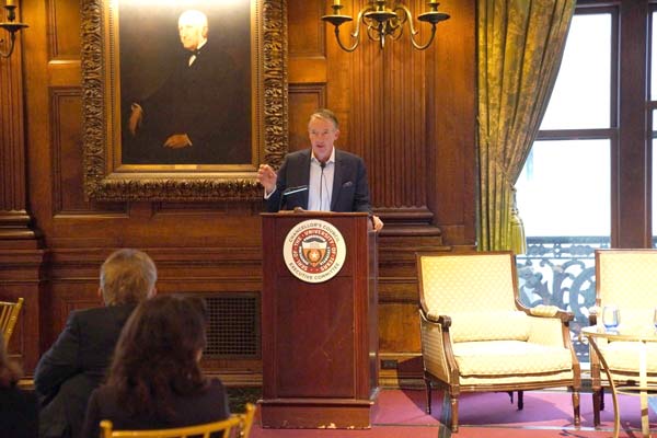UT Austin President Hartzell speaking at a podium