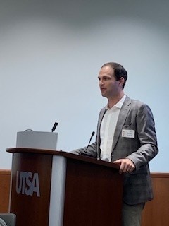 Zlotnik speaking at the podium