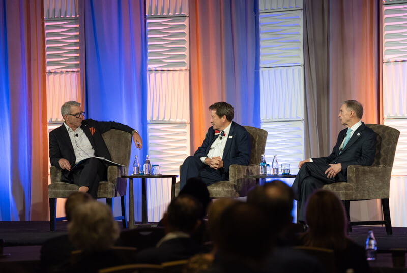 Chancellor Milliken, Roberte Cauliff and Dr. Peter Pisters discuss cancer research on stage.