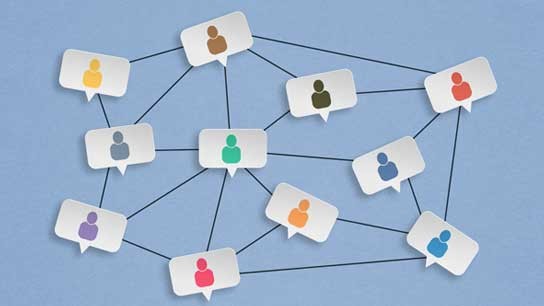 Networking graphic of icons of people in speaking bubbles.