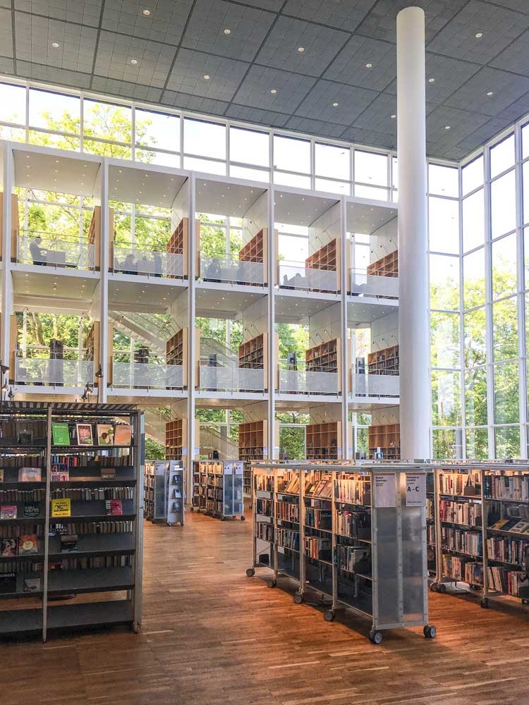 Library building interior with lots of books and windows