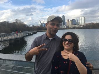 Yashambari Ajinkya and partner in front of downtown Austin and Town Lake