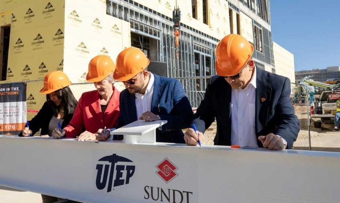 Officials including, (from left) UTEP Student Government Association President Andrea Nunez, President Heather Wilson, Sundt Project Manager Daren Mieles and Sundt Vice President Joseph Riccillo, signed a construction beam at today's ceremony.
