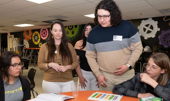 UTPB student teacher directing middle school teachers at after school event