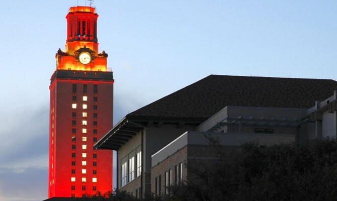 The UT Austin Tower illuminated orange with the numeral 1 created by lighted windows.