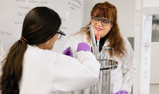 Teacher and student in the biotech lab