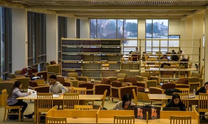 Students studying in the on-campus library at UTPB. 