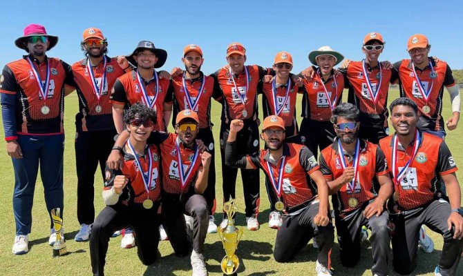 The Comet Cricket Club celebrates with their trophy and poses for a group photo after winning the National College Cricket Association championship