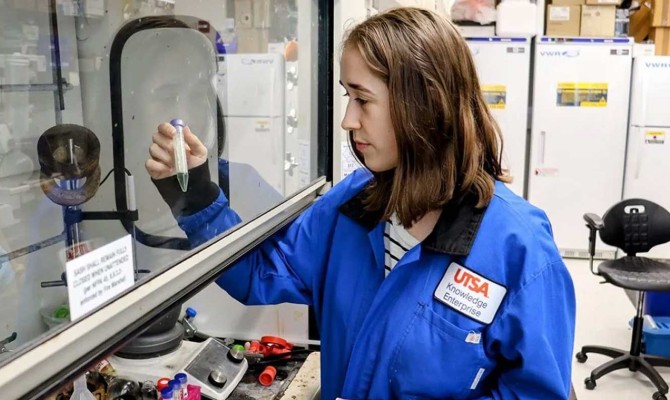 Honors College biochemistry student, Lauren Wolff, monitoring formation of nanoparticles.